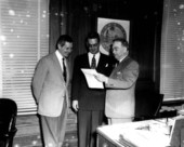 Collins, McCarty and Gray discussing at office - Tallahassee, Florida.