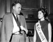 Governor Claude Kirk talking with Miss Florida Dawn Cashwell