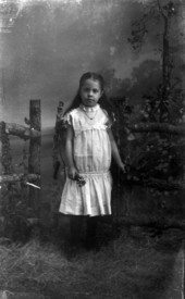Mary L. Griffith holding a sprig of flowers.