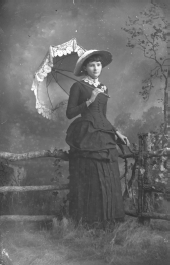 Young woman holding a parasol.
