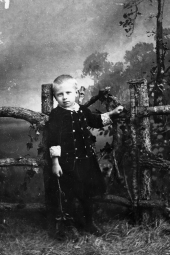 Young boy at the gate.