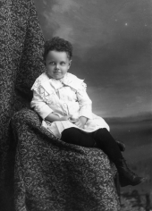 Boy with curly hair.