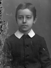 Portrait of a seated boy.