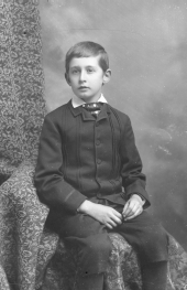 Seated boy with knickers.
