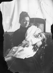 Mother holding her deceased child.