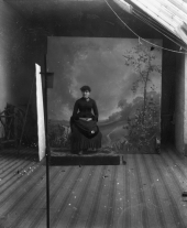 Woman seated for portrait session.
