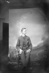 Young man posing in Harper's studio.
