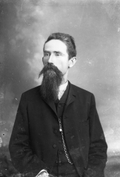 Man with long mustache and goatee.