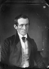 Unidentified man sitting for a portrait.