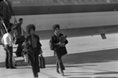 Kathleen Cleaver, right, leaving airplane during her visit to Tallahassee, Florida.
