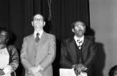 View showing the Tallahassee Civil rights leader Reverend C.K. Steele standing at the right in an auditorium.