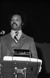 Civil rights leader Jesse Jackson delivering a speech in an auditorium - Tallahassee, Florida.