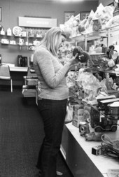 Woman looking at items in a store at the Northwood Mall - Tallahassee, Florida.