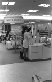 Employees dressing mannequin in a clothing store at the Northwood Mall - Tallahassee, Florida.