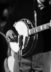 Close-up view of a banjo player performing at the 1970 Florida Folk Festival - White Springs, Florida.