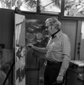 Artist Elden Rowland painting at his studio in Sarasota, Florida.