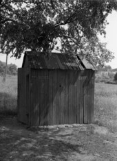 Outhouse showing entrances for boys at the left and girls on the right.