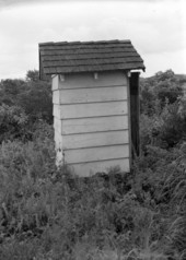 Side view of an outhouse.