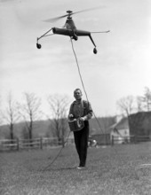 View showing a remote-controlled model helicopter being flown by its creator Arthur M. Young in Paoli, Pennsylvania.