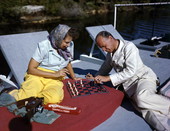 Lois playing chess with Kase aboard the shantyboat "Lazy Bones".