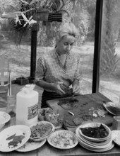 Artist Beth Arthur working on the patio of her home in Sarasota, Florida.
