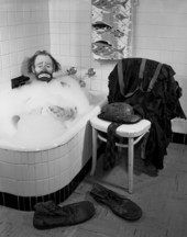 Ringling Circus clown Emmett Kelly in a bubble bath.