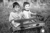 Seminole children in a toy wagon at the Brighton Indian Reservation.