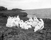 Nuns meditating at dusk on the south rocks in the Dominican Republic.