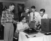 Members of the Florida Photographers Association gathered around a record player during a fall conference in Orlando, Florida.