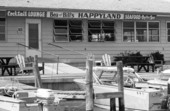 Close-up view of Bea & Bill's Happyland seafood restaurant at 9009 Midnight Pass Rd. on Siesta Key, Florida.