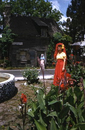 View showing a couple of women in front of the Oldest Wooden School House in the U.S.