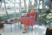 Unidentified woman sitting on the patio of a Sarasota home.