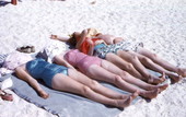 View showing people tanning at Lido Beach on Lido Key near Sarasota, Florida.