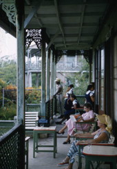 View showing the photographer's wife, Lois Foley Steinmetz, reading on a veranda in Nassau, Bahamas.