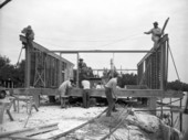View showing workers constructing architect Ralph Twitchell's cantilever roof house on Siesta Key near Sarasota, Florida.
