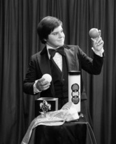 Jose Rey performing a magic trick in Sarasota, Florida.