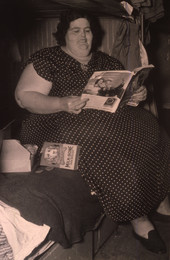 Ringling Circus fat lady, Alice from Dallas, reading a magazine on the circus train in Sarasota, Florida.