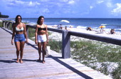 Young women on boardwalk at the Fort Pierce beach.
