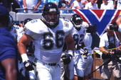 Jacksonville Jaguars #66 Shawn Bouwens heading to field with team during their inaugural game against the Houston Oilers.