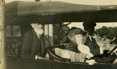 Mr. and Mrs. Nathan Kelley with their son E.B. Kelley driving.