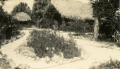 Small garden surrounded by walkway on the Koreshan Unity property in Estero, Florida.