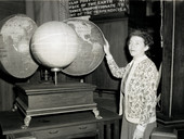 Koreshan Unity president Hedwig Michel explaining "Cellular cosmogony" with the use of a globe at the museum in Estero, Florida.
