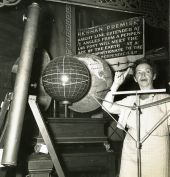 Koreshan Unity president Hedwig Michel lecturing on the Koreshan Premise with the use of a globe at Art Hall in Estero, Florida.