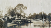 Koreshans gathered by boats during festival time in Estero, Florida.