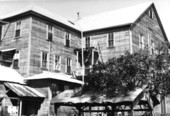 Southeast corner of Koreshan Unity's dining hall building with dormitories in Estero, Florida.