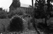 Northeast corner of Koreshan Unity's dining hall building with dormitories in Estero, Florida.