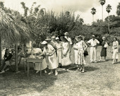 Guest book being signed during the 1957 Solar Festival at Koreshan Unity in Estero, Florida.