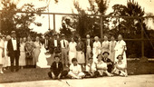 Group portrait of Koreshans during an Easter party at the tennis court.
