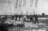 Koreshans setting up "The Air Line" rectilineator on the beach in Naples, Florida.