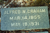 Close-up view of headstone for Alfred W. Graham in the Koreshan Unity cemetery at the Koreshan State Historic Site park in Estero, Florida.